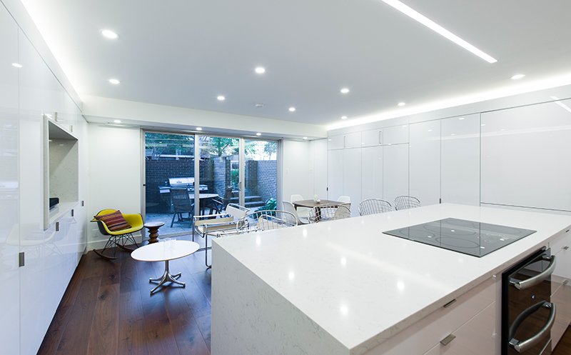 Room opening onto the patio through a full-height sliding door